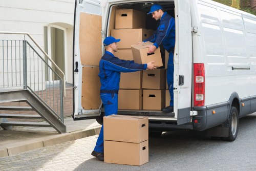 Removal van and packed boxes for Chiswick moving services