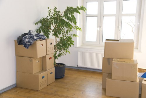 Professional movers loading furniture for a Chiswick flat move